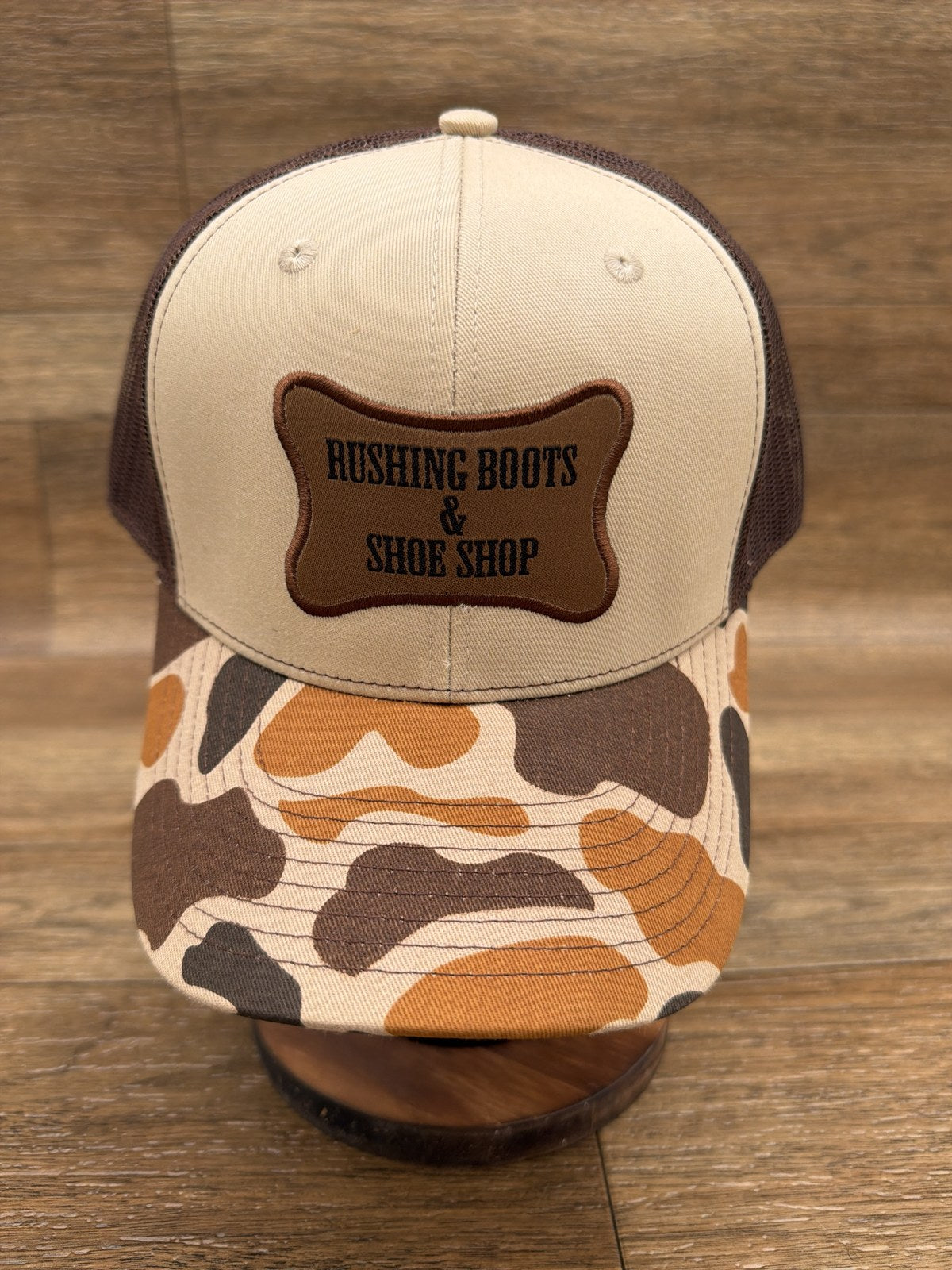 Rushing Boots & Shoe Shop trucker cap, front