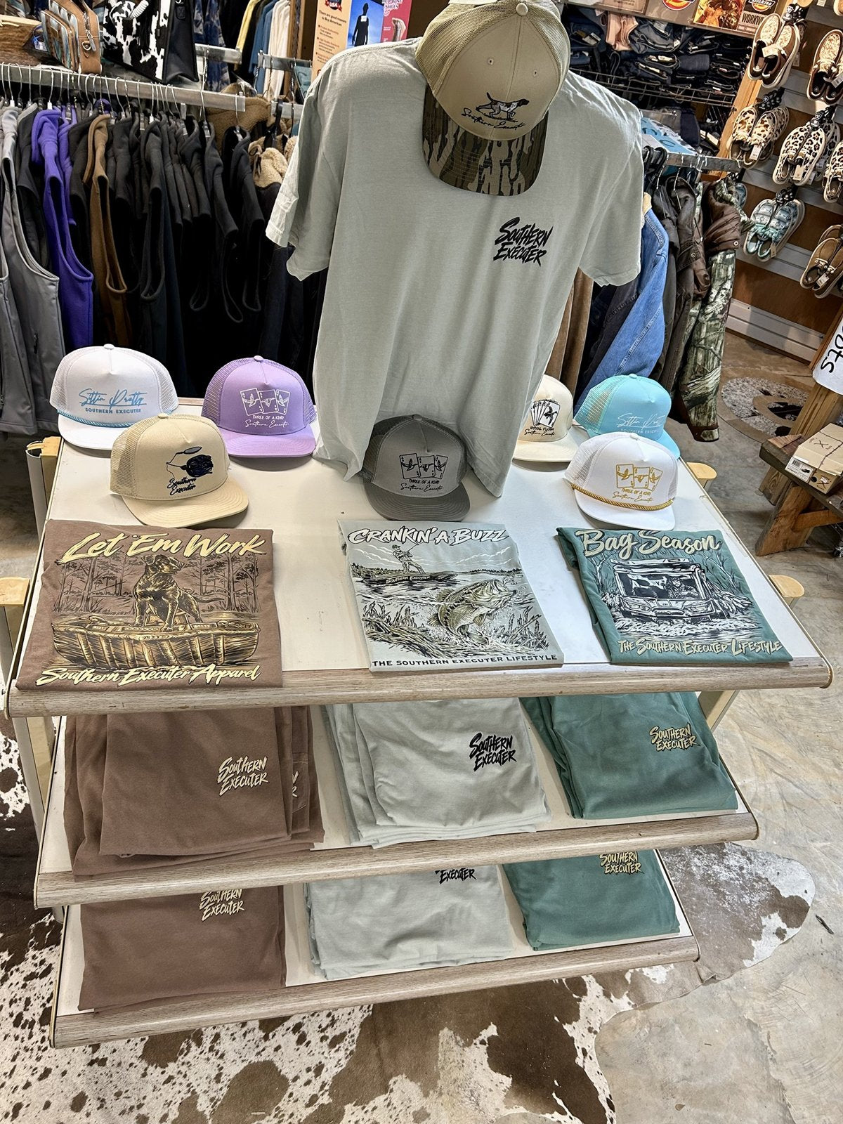 Southern Executer graphic tees and caps on display at Rushing Boots in Ferriday