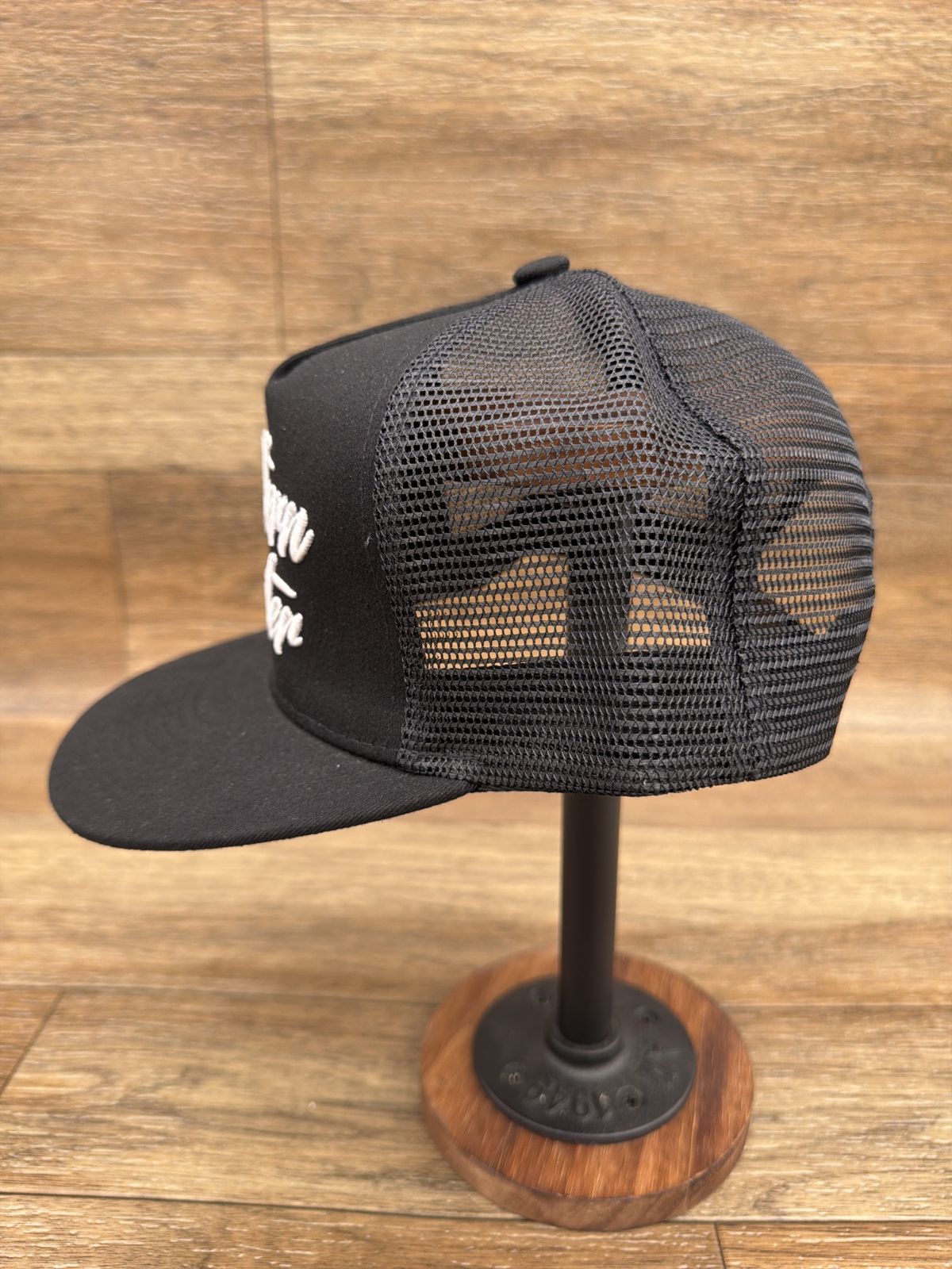 Script logo flat brim trucker cap in Black by Southern Executer, side