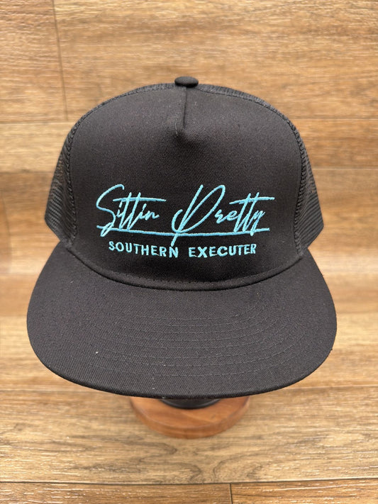 Sittin' Pretty flat brim trucker cap in Black by Southern Executer, front