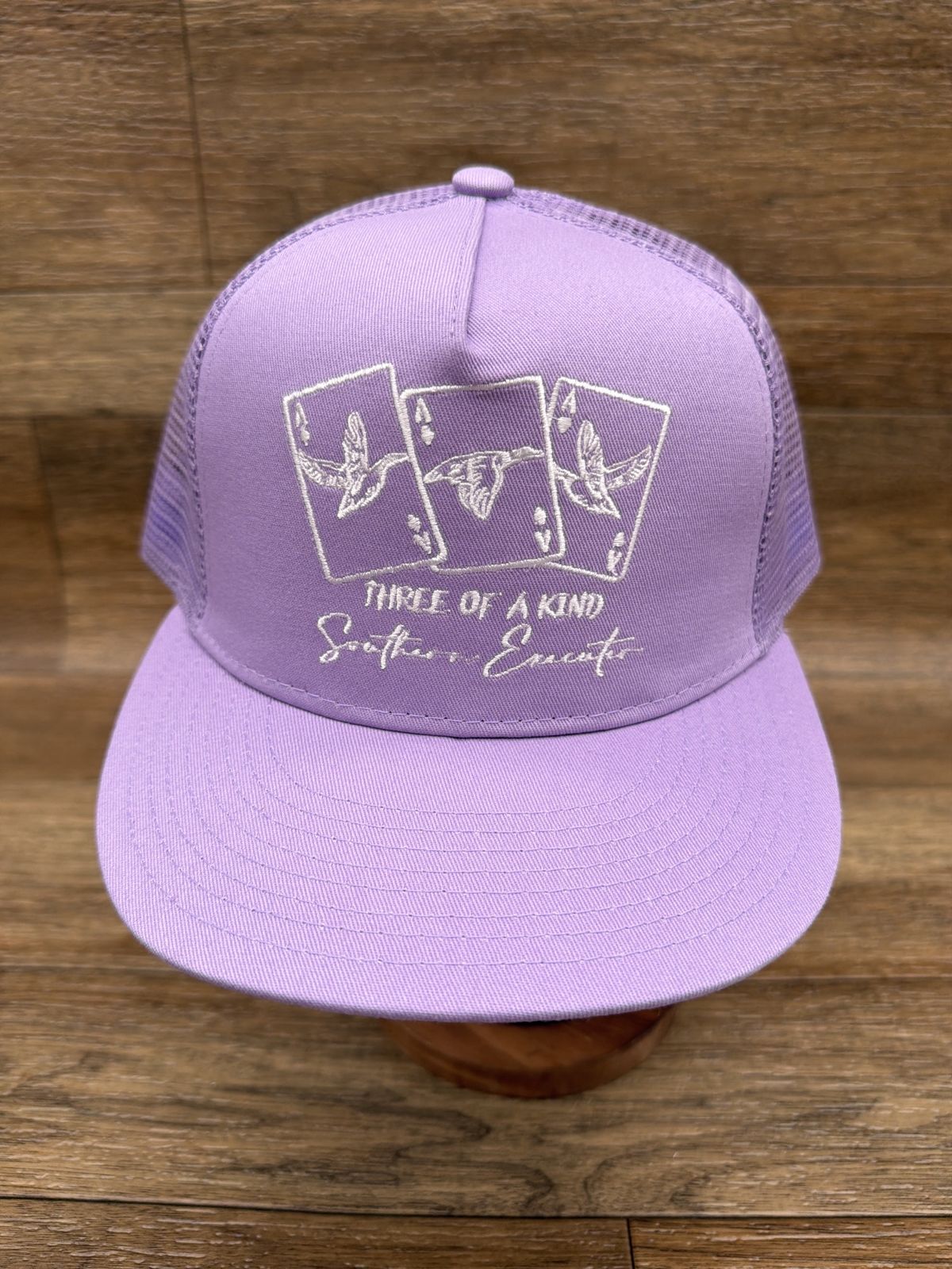 Three of a Kind flat brim trucker cap in Lavender by Southern Executer, front